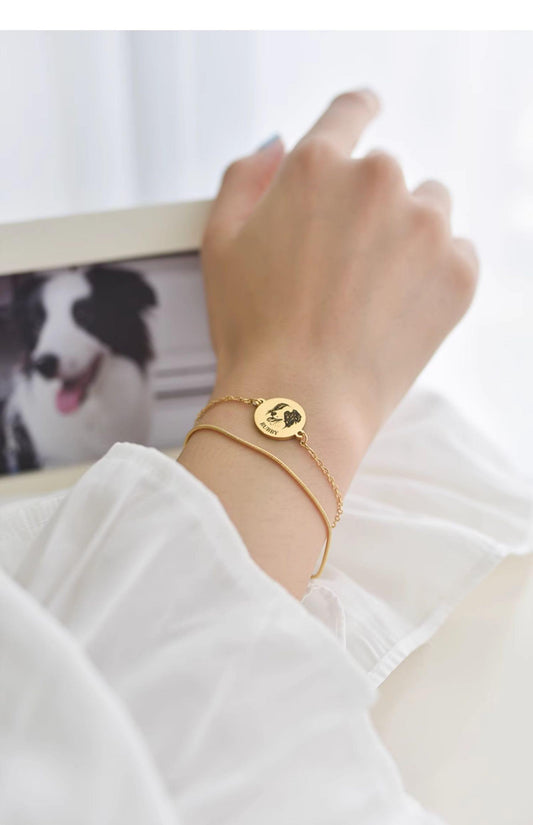 Wearing a custom pet face bracelet with a photo frame of a deceased pet
