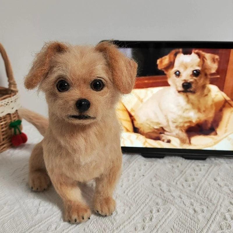 Wool felt replica of a chihuahua in front of a computer