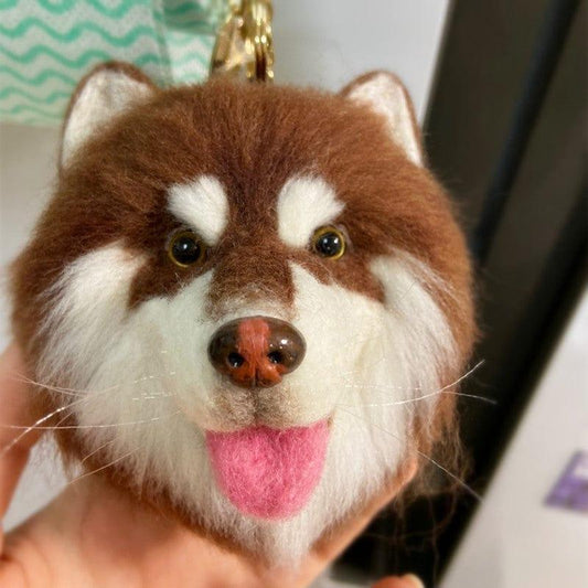 Decorative brown and white dog head pendant